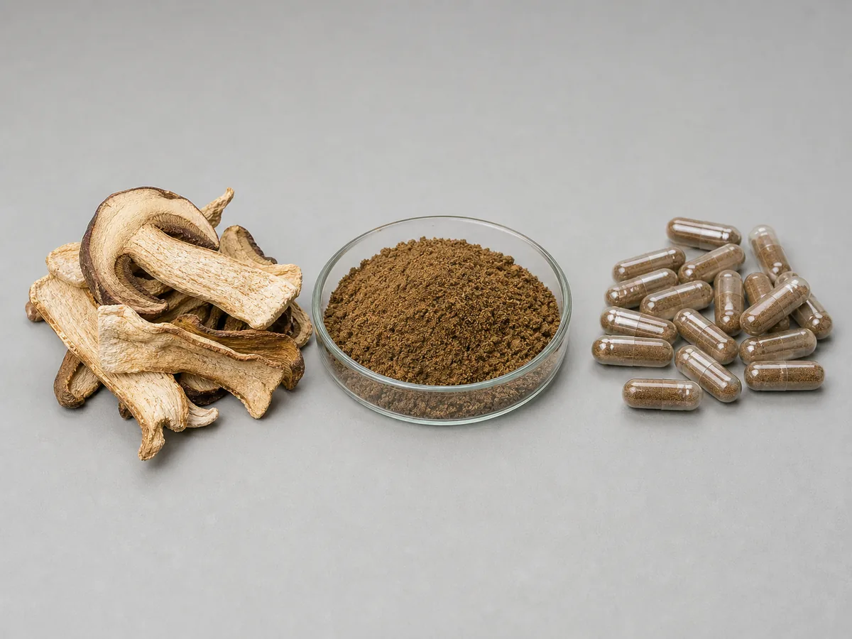 Dried mushroom slices, coarse brown powder and clear capsules compared side by side on a grey backdrop