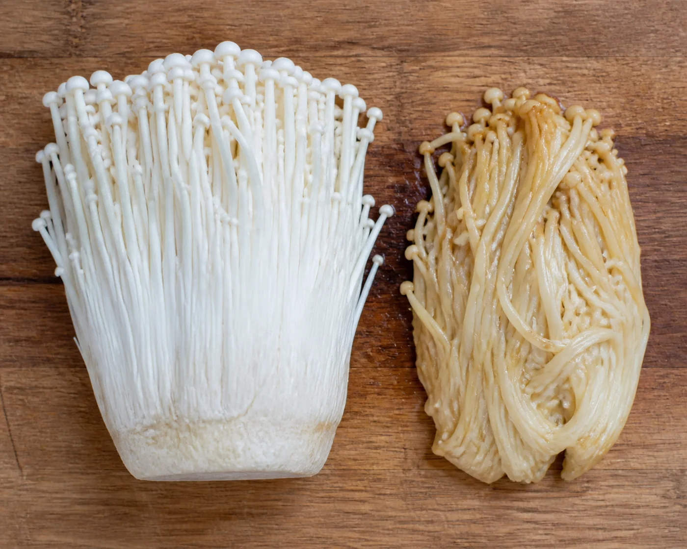 A bundle of raw white enoki beside a portion of the same mushrooms wilted and browned after cooking